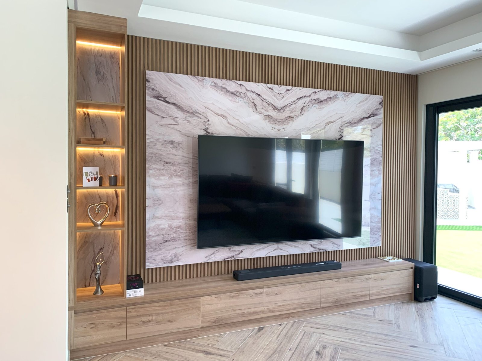 Marble and timber media wall with television